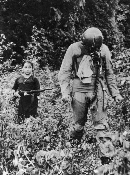u.S. Air Force lieutenant captured by a young North Vietnamese female soldier, Vietnam, 1967