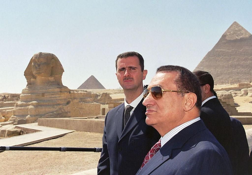 syrian president Bashar al assad with Egyptian leader hosni mubarak during his trip to Egypt, both w…