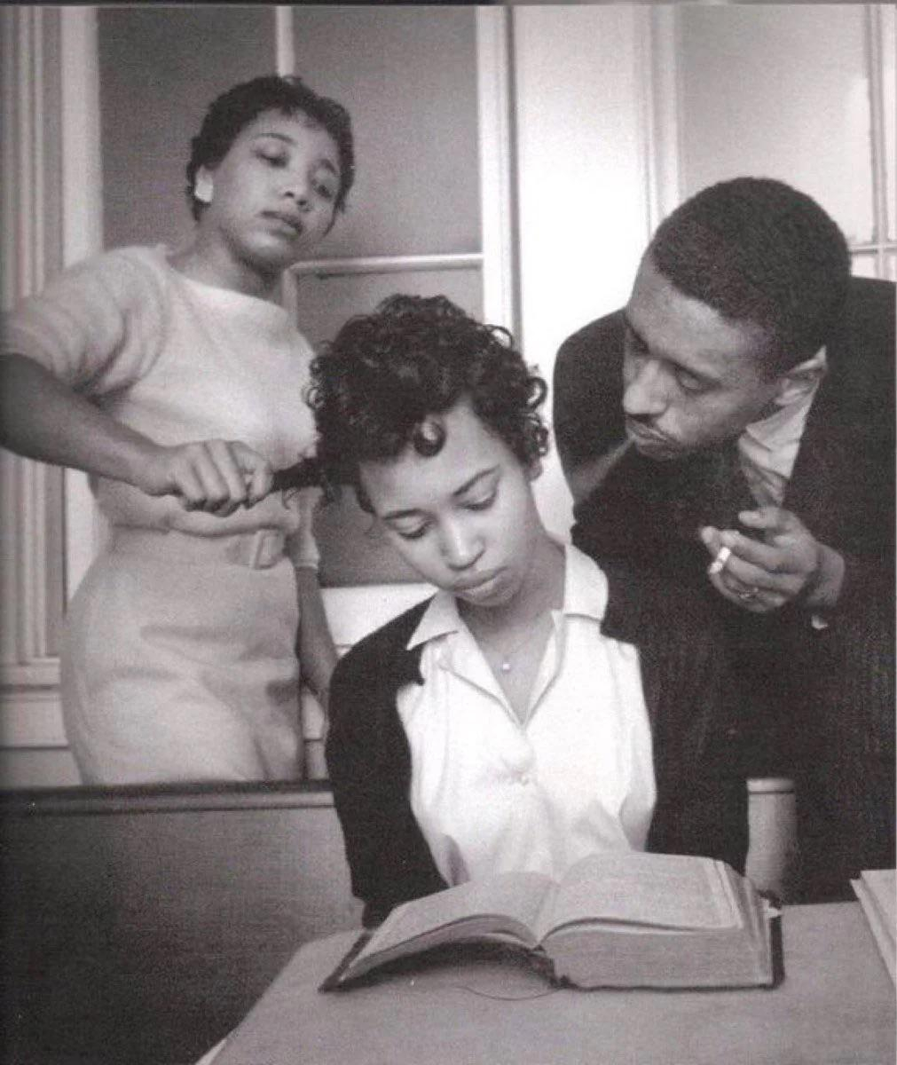 a young girl in a school for Black civil rights activists being trained to not react to smoke blown…