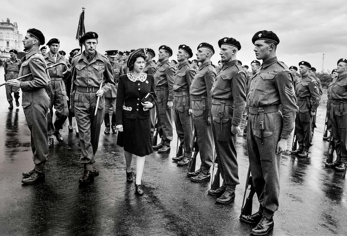 18-year-old Princess Elizabeth, the future queen, inspects an honor guard of the Second Battalion Gr…