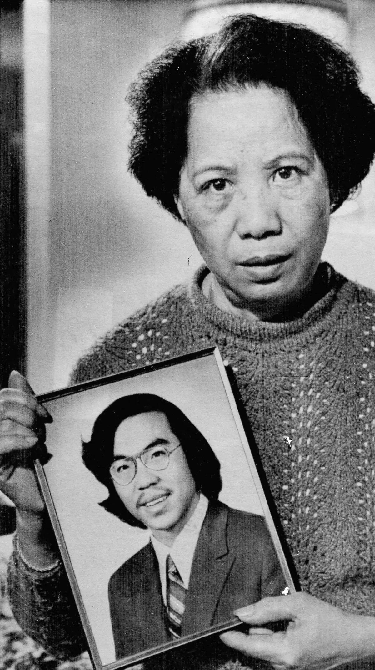 lily Chin holds a photo portrait of her son Vincent in 1983,…
