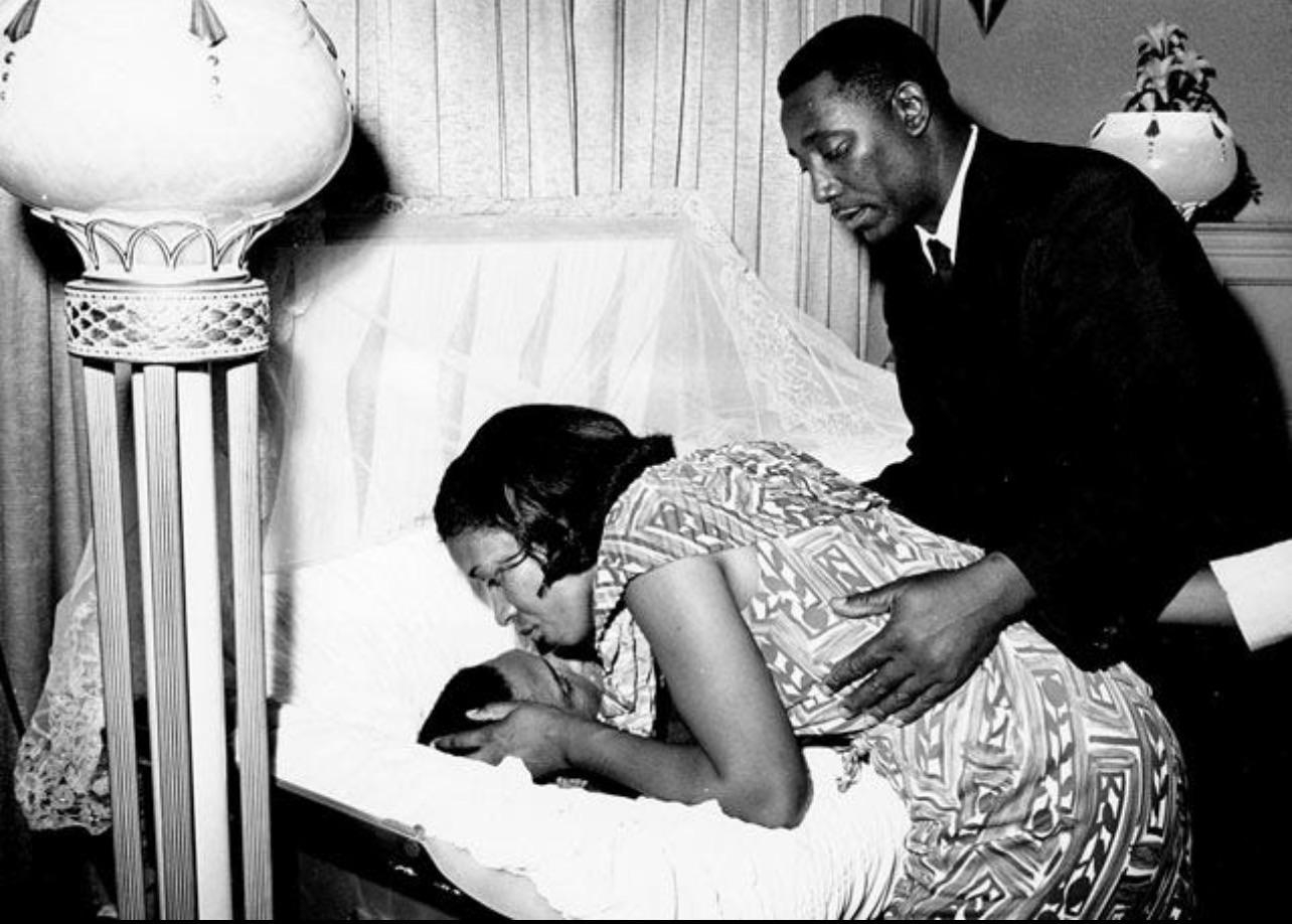 june 13, 1963: Myrlie Louise Evers kisses the forehead of her husband, civil rights activist Medgar…