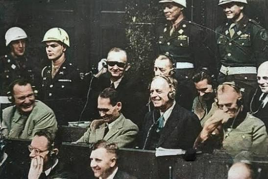 1945 Nuremberg Trials, Nazi officials, including Hermann Göring and Rudolf Hess, were seen laughing,…