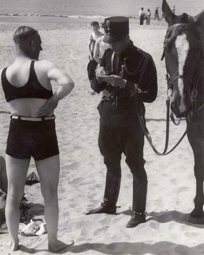 a man on the beach is fined for indecent clothing, Heemskerk, Netherlands, 1931