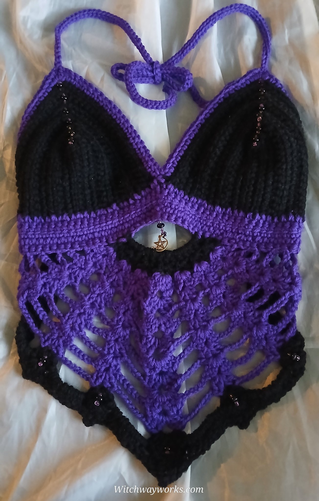 Another beaded haltertop! But this time in a lovely black and purple! The beads are all hand sewn in…