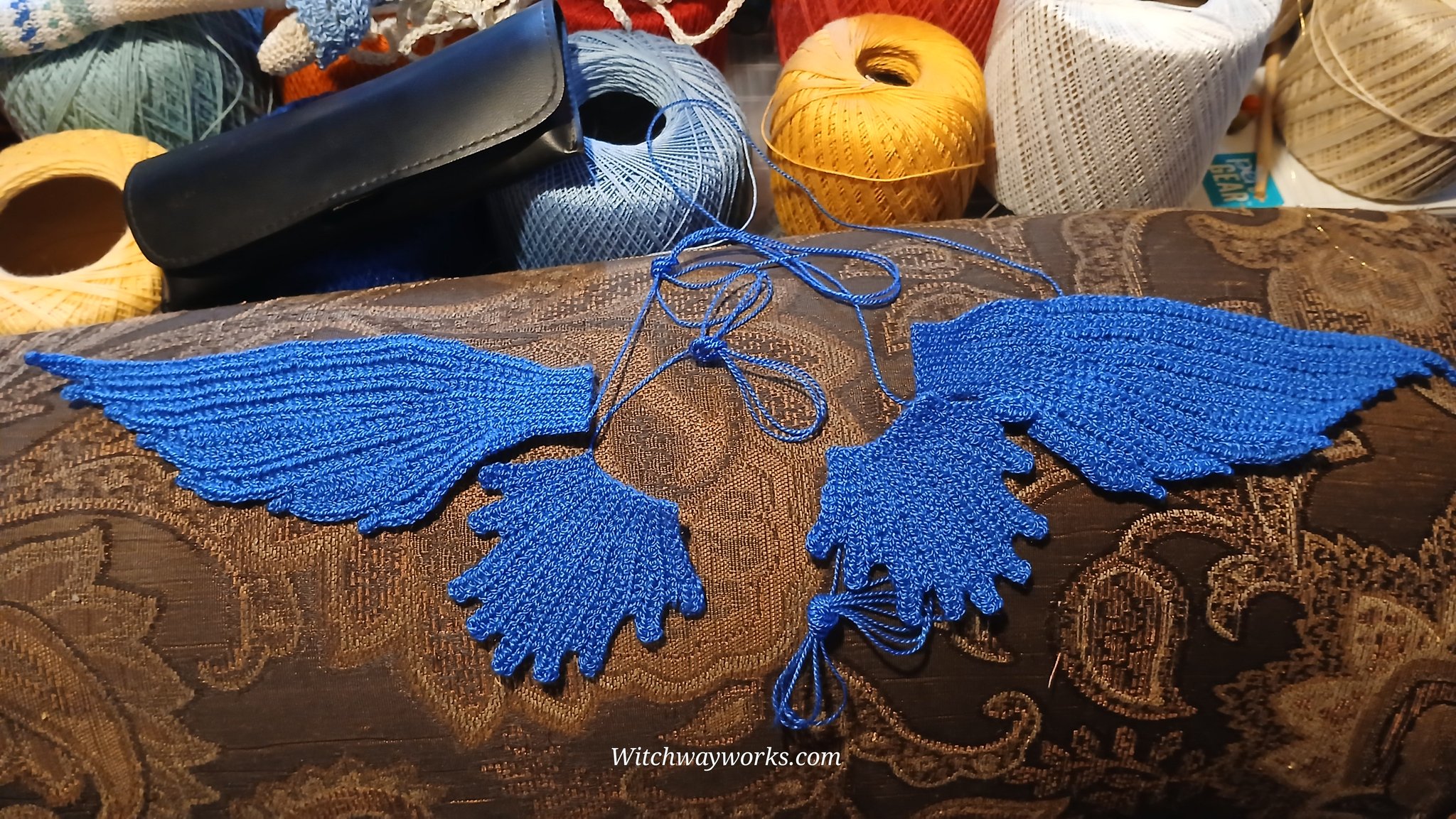 Believe it or not... these are not wings. This is the outer skirt before sewing its parts together,…